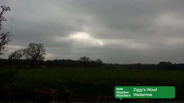 Cloudy skies over a field in Wadenhoe