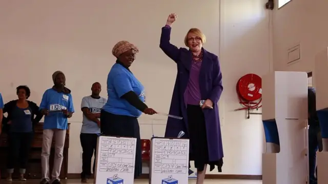 
          Democratic Alliance (DA) leader, Helen Zille gestures after casting her ballot for the general elections on May 7, 2014 at a polling station in Cape Town.
        