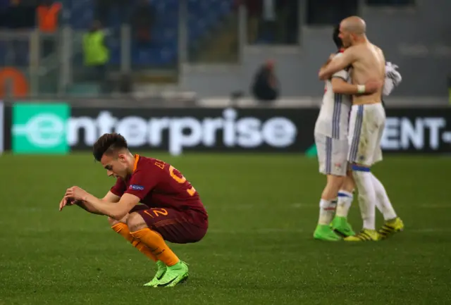 
          Roma"s Stephan El Shaarawy looks dejected after the match as Lyon players celebrate
        