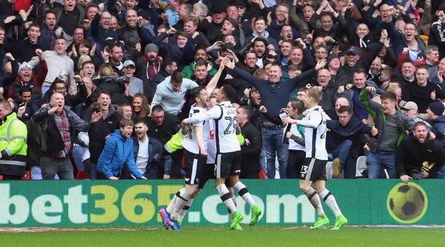 Derby celebrate their second goal against Forest