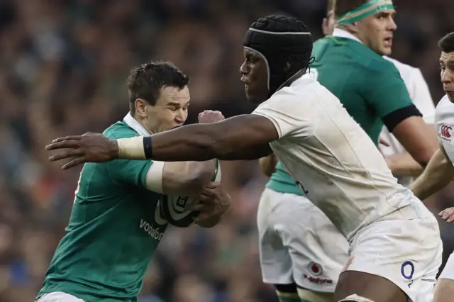 Maro Itoje tackles Jonny Sexton