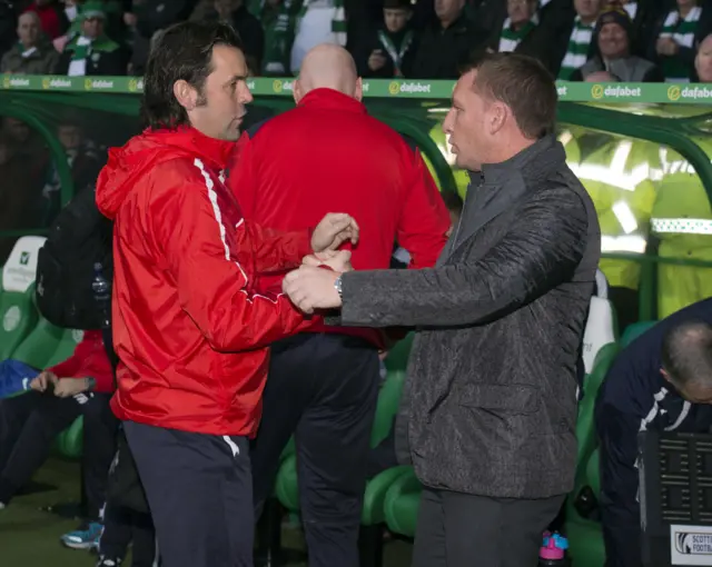 Dundee manager Paul Hartley and Celtic's Brendan Rodgers