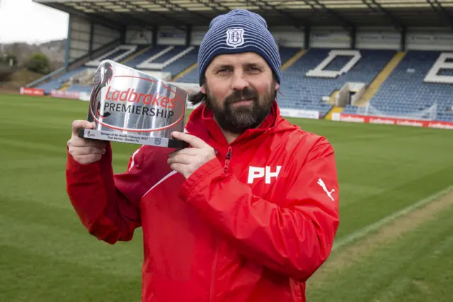 Dundee's Paul Hartley with his manager of the month award