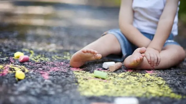 child with chalks