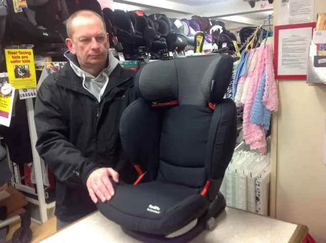 Iain Temperton with the child booster seat