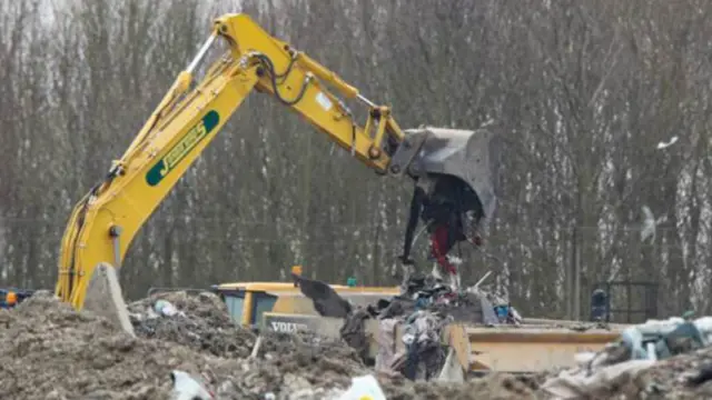 Excavator at Milton landfill site