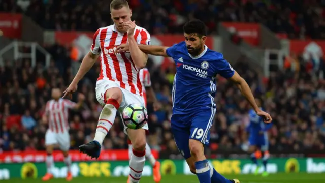 
          Ryan Shawcross of Stoke City is tackled by Diego Costa of Chelsea
        