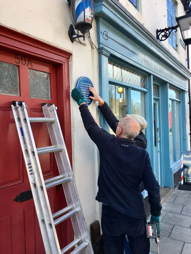 Installation of blue plaque