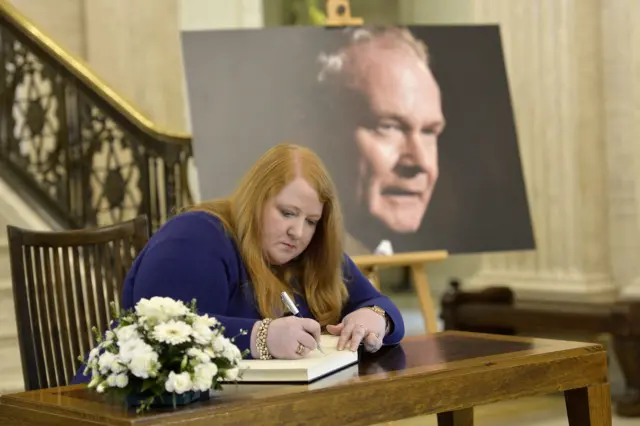 Naomi Long signs the book of condolence