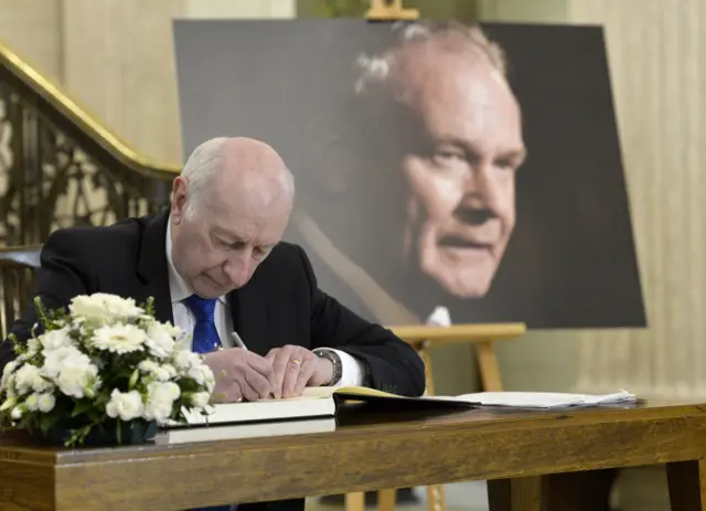 Robin Newton signs the book of condolence