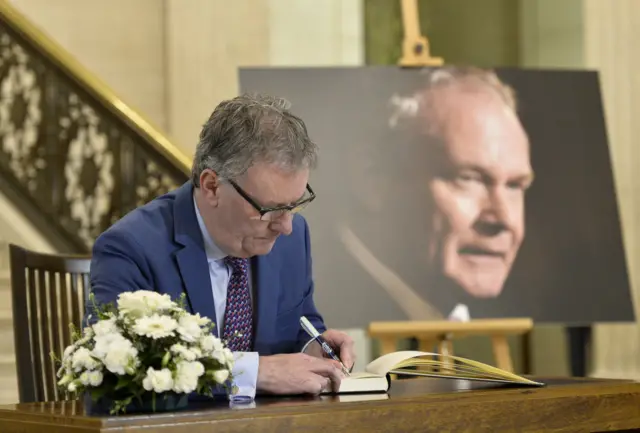 Mike Nesbitt signs the book of condolence