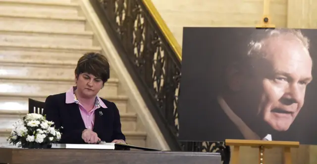 Arlene Foster signs the book of condolence