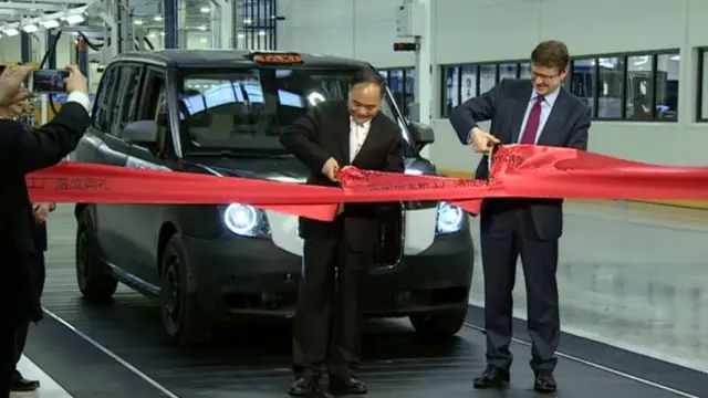 Ribbon being cut on assembly line