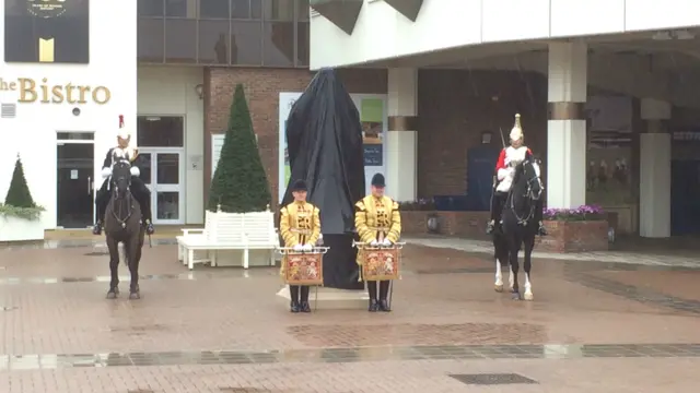 The scene in Newmarket outside the statue