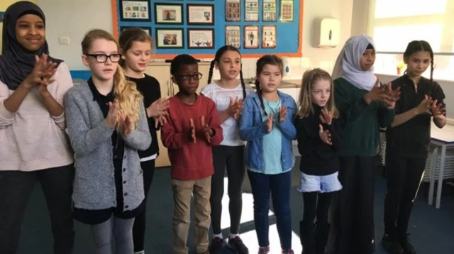 Pupils learning sign language together