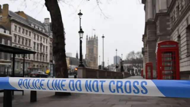 Police close a road in Westminster