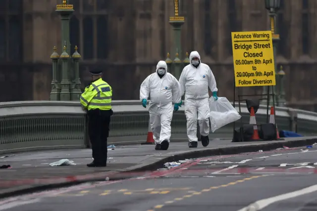 Forensic scientists work on Westminster Bridge