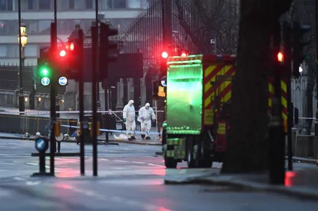 Forensic scientists work on Westminster Bridge