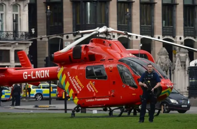 Armed officer in front of Air Ambulance