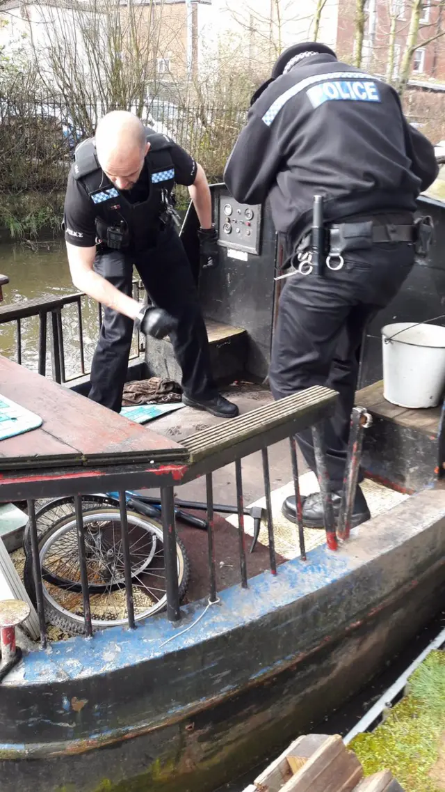 Officers searching barge