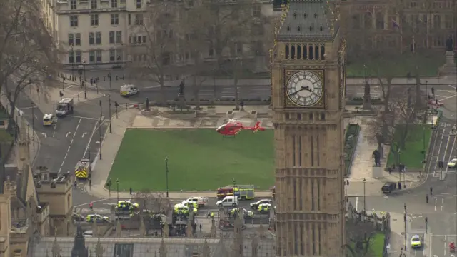 
          Aerial shot of Big Ben at 15:40, with police vehicles, and helicopter
        