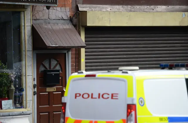 
          Police van outside raided property in Hagley Road, Birmingham
        