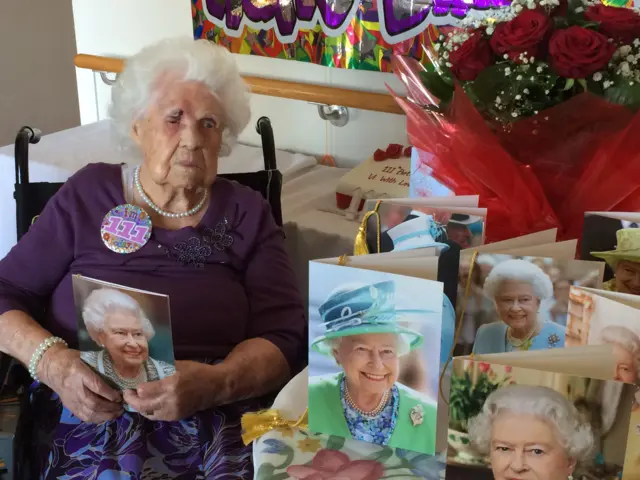 Francis Malin with birthday cards featuring the Queen