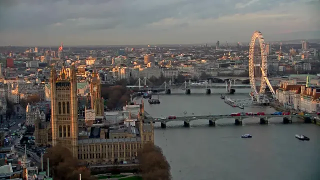 
          Aerial view of Westminster, showing River Thames and London Eye
        