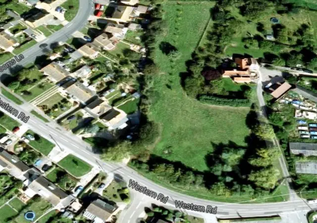 
          The houses are planned for a greenfield site off Western Road
        