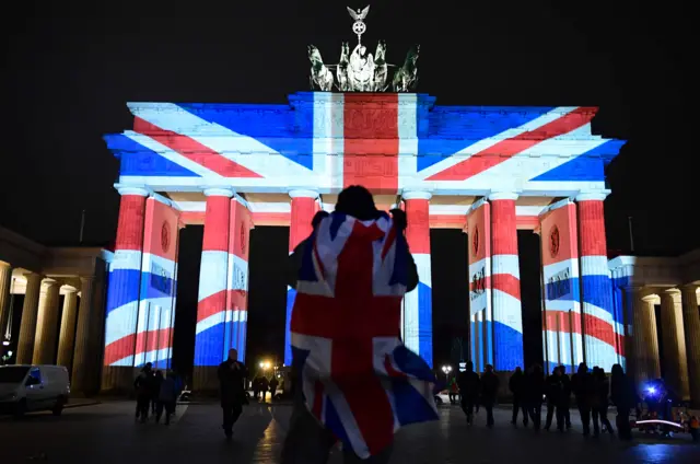 
          Brandenburg Gate in Berlin is illuminated with the colours of the Union Jack
        