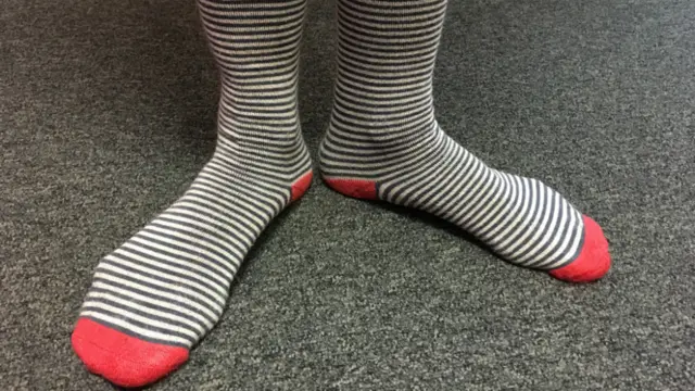 Receptionist's red socks