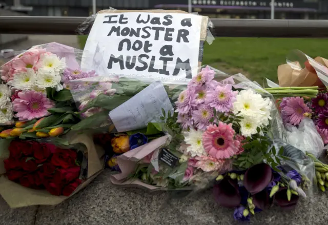 
          Flowers and tributes outside the Queen Elizabeth II conference centre in Westminster
        