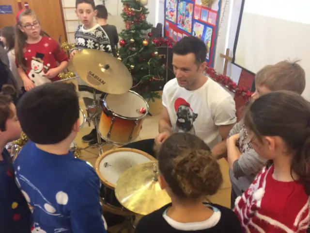 Harry Judd with pupils from St Gregory's primary school