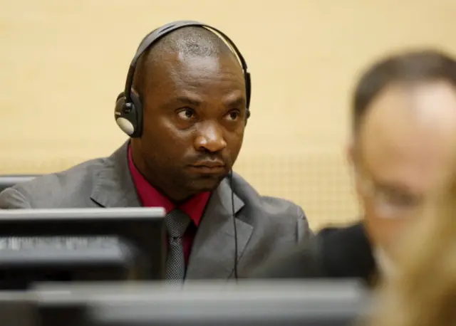 
          Congolese national and former millitia chief Germain Katanga looks on during the closing statements in his and fellow former millitia chief Mathieu Ngudjolo Chui's trial, at the International Criminal Court (ICC) in The Hague on May 15, 2012
        