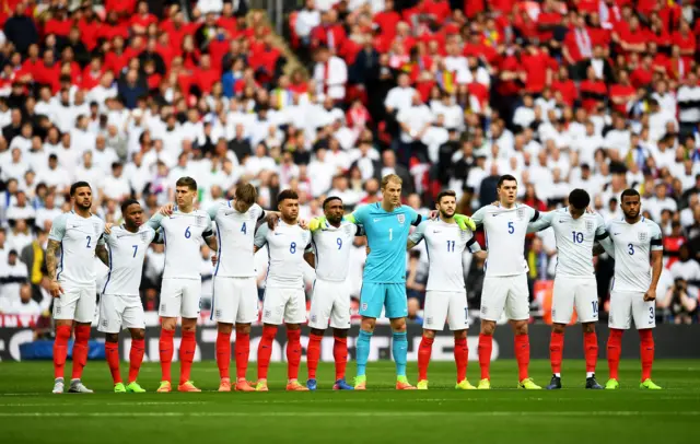 England players observe a minute's silence