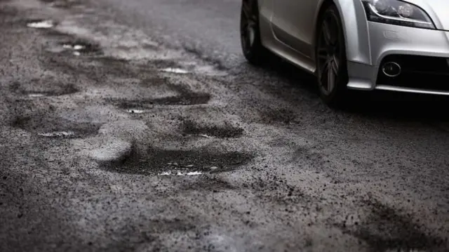 Pothole in road