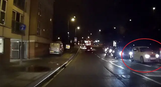 White hatchback vehicle