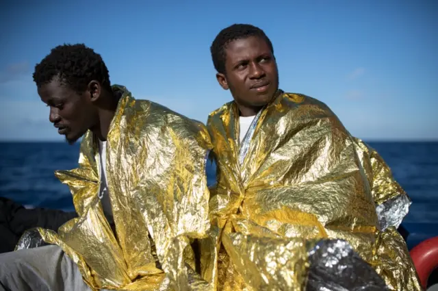 Migrants on a rescue boat