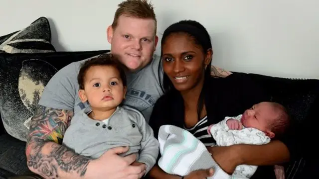 Darren Rogers and his family including new arrival