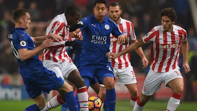 
          Leicester and Stoke players in action in their last game in December
        