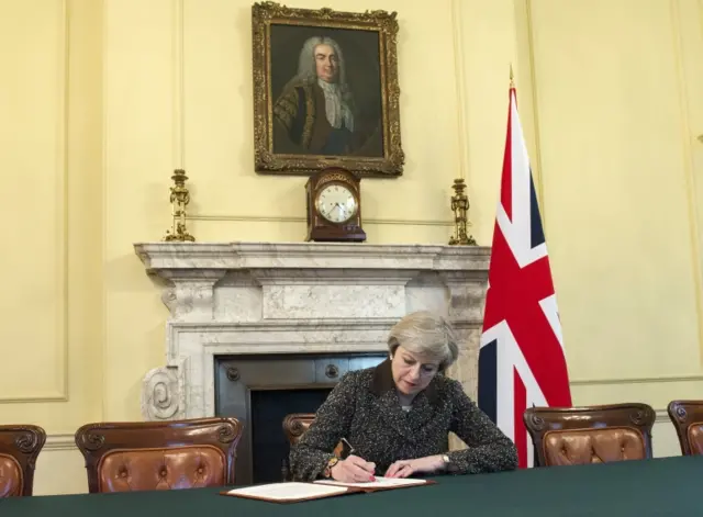 Theresa May signing Article 50 letter