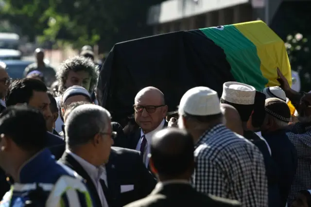 Coffin being carried