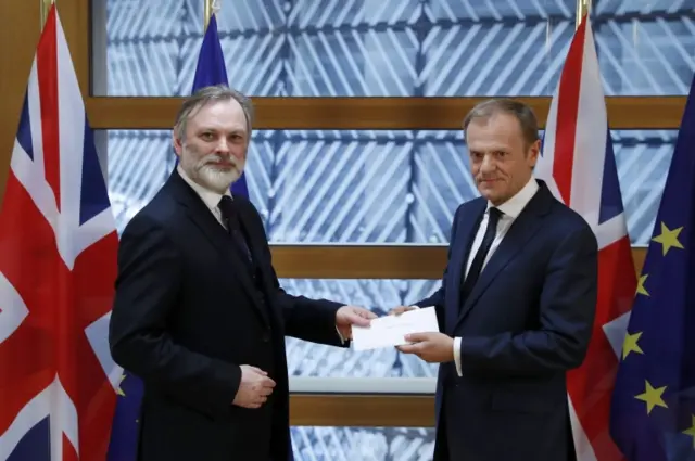 
          UK diplomat Tim Barrow handing the letter to EU Council president Donald Tusk
        