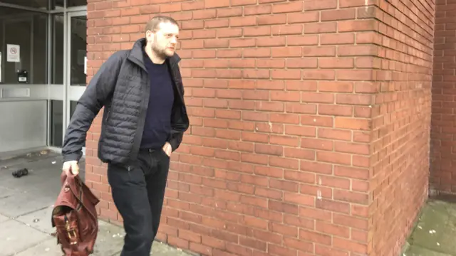 Simon Davies leaving court