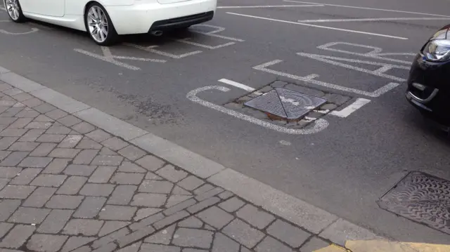 Man hole in road