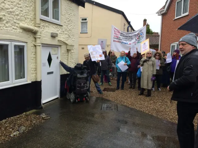 Protestors outside the office of George Freeman MP