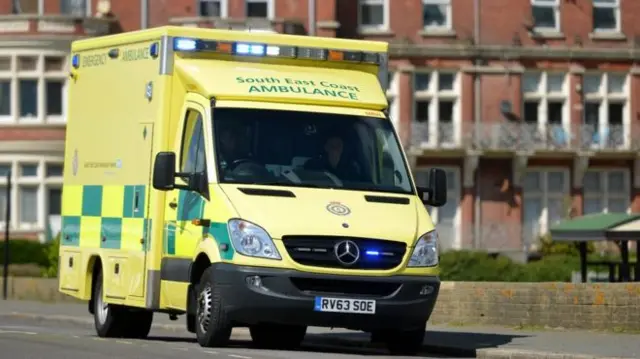 Ambulance driving along road