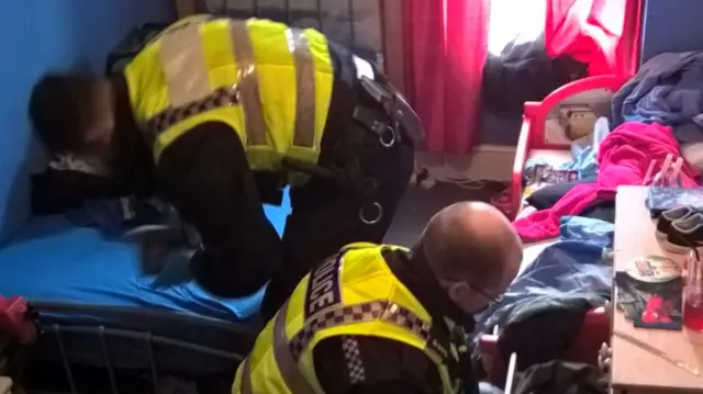 officers searching a house