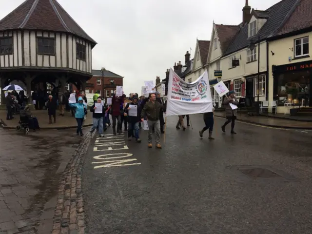 
          Protestors set off from Wymondham market cross on their march
        