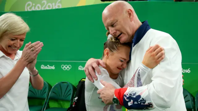 Amy Tinkler celebrating winning her bronze medal